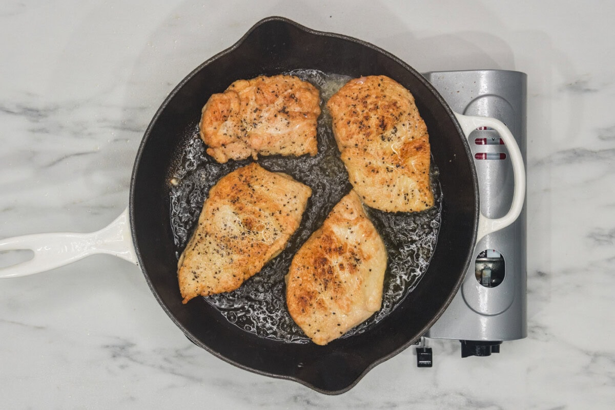 seared chicken in a skillet