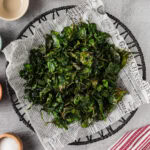 Crispy Air Fryer Spinach on parchment paper