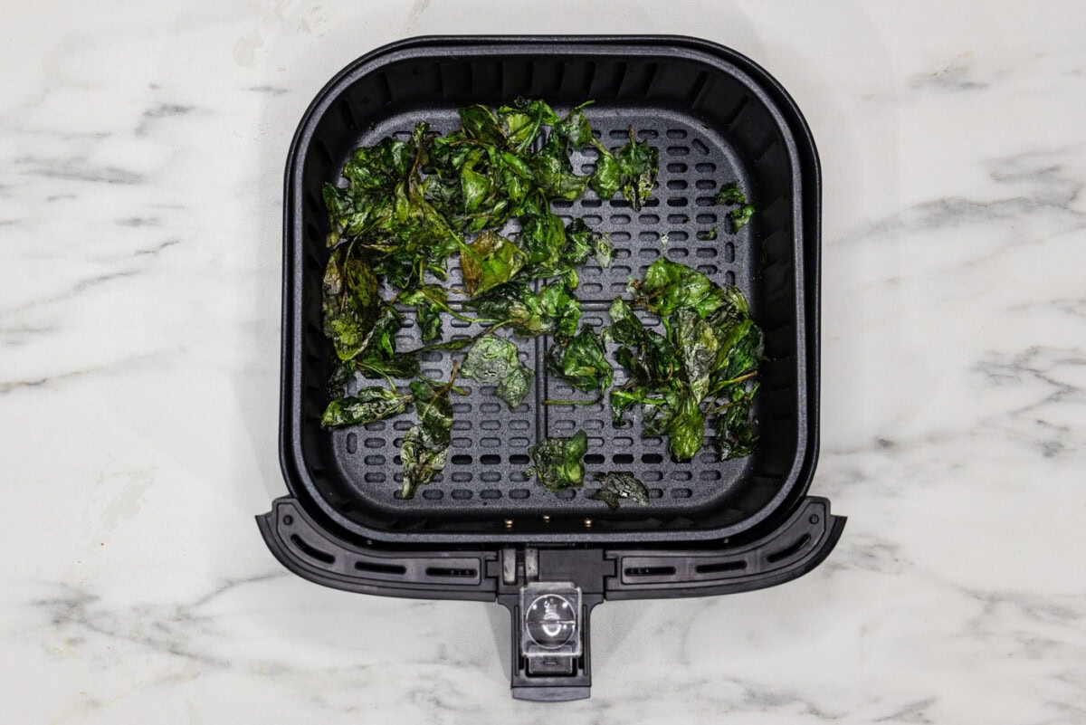 spinach chips in air fryer basket