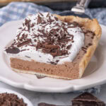 Slice of French Silk Slab Pie being placed on a plate