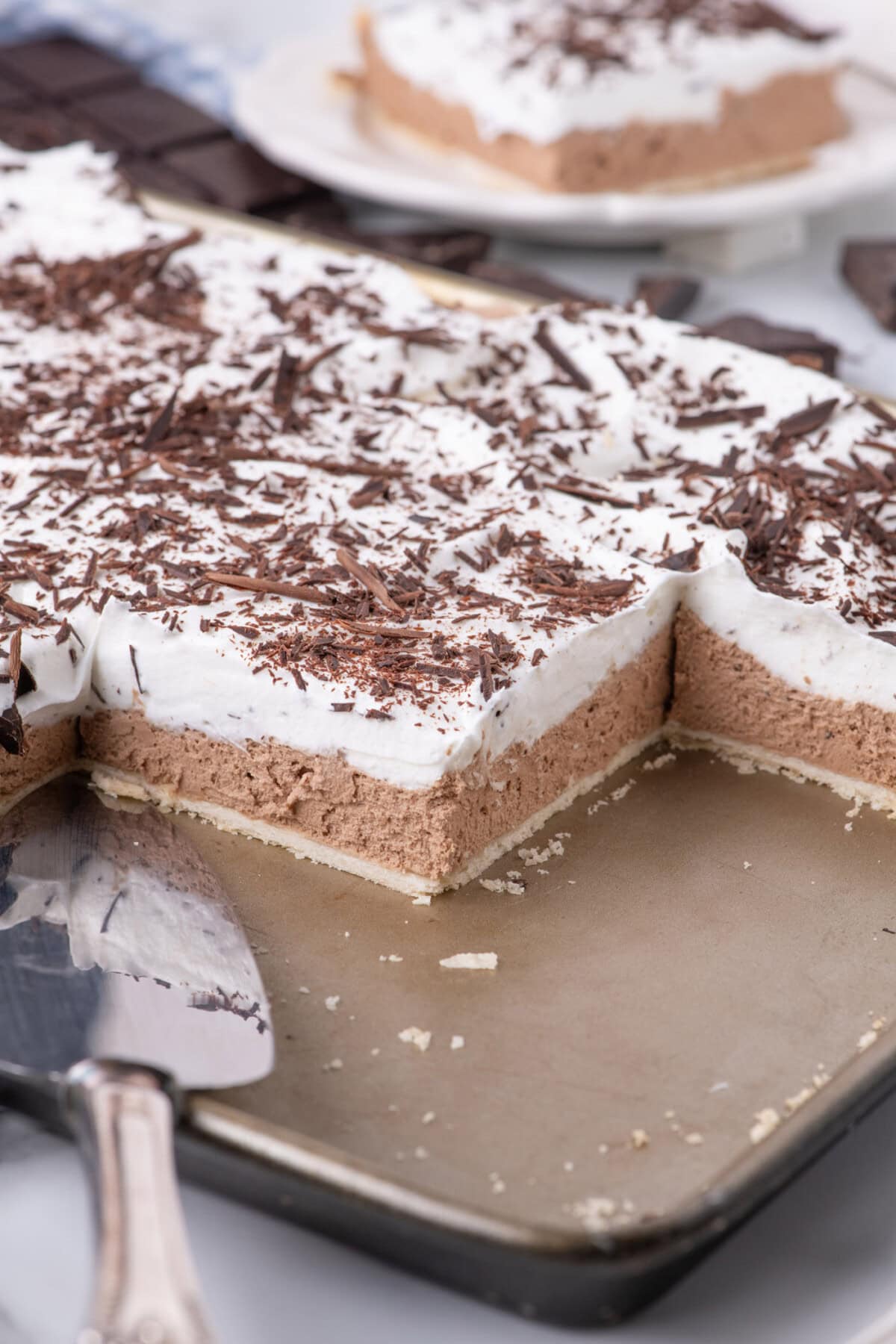 Close up photo of a French Silk Slab Pie with slices removed