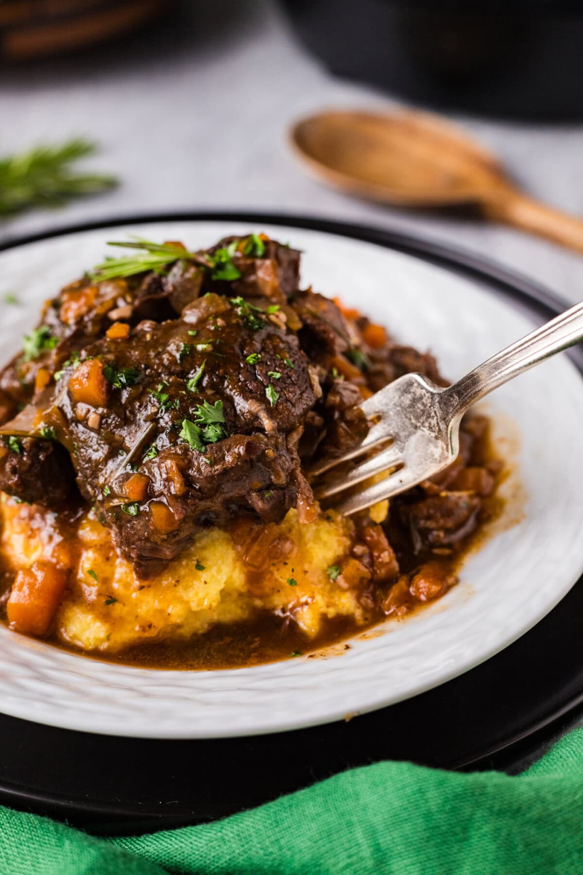 Close up photo of a fork going into Instant Pot Beef Shanks
