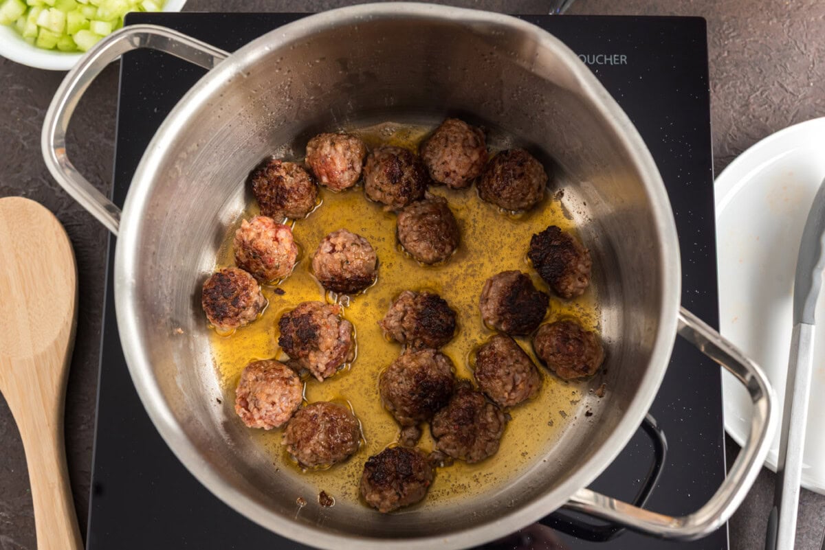 sausage and orzo in a soup pot