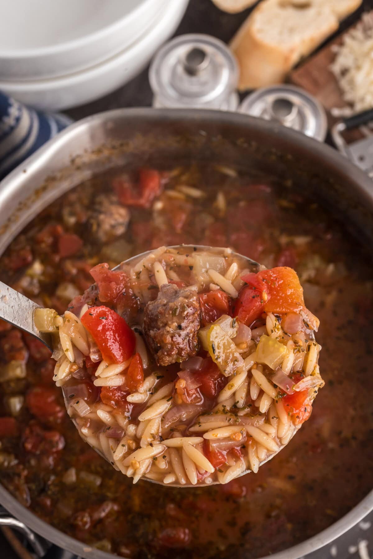 Ladle of Italian Sausage Tomato Orzo Soup
