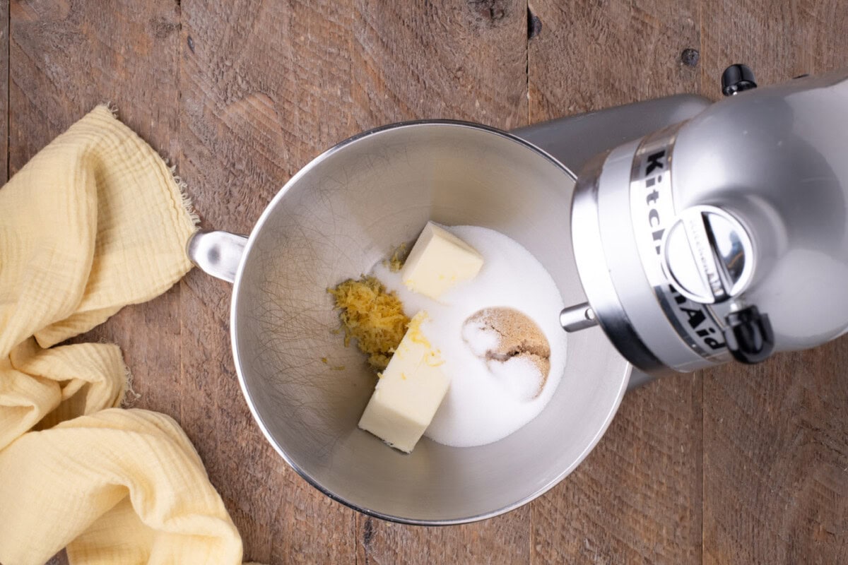 butter and sugars in a bowl of a stand mixer