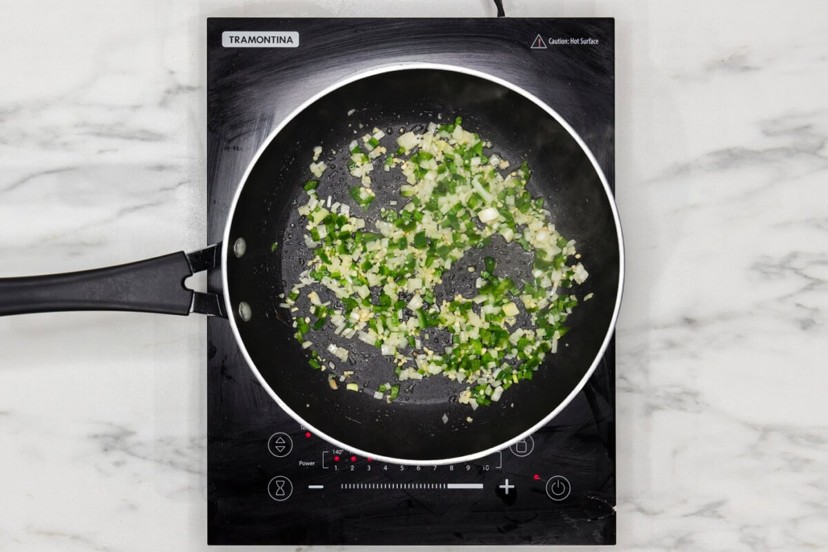diced onion and jalapenos in a skillet
