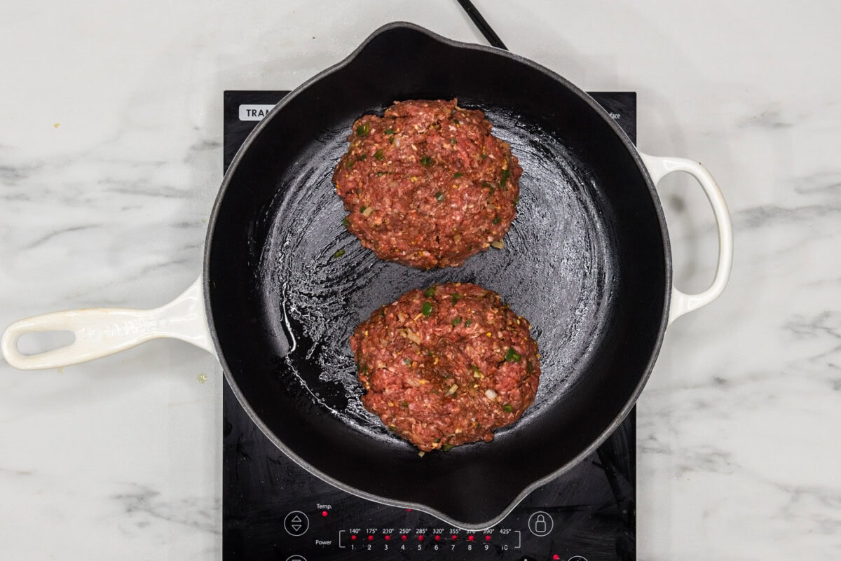 burger patties in a skillet
