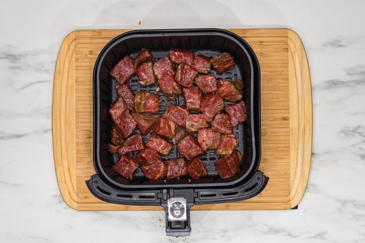 steak bites in an air fryer basket