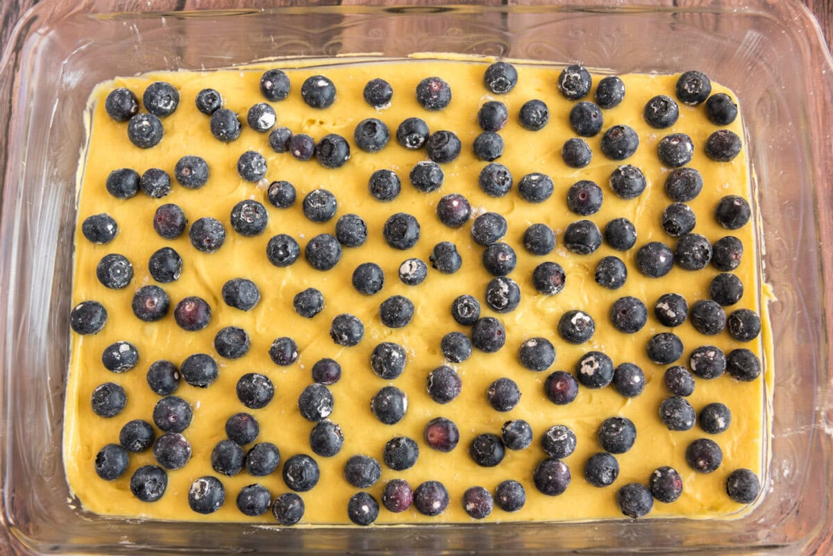 blueberries on top of lemon cake batter