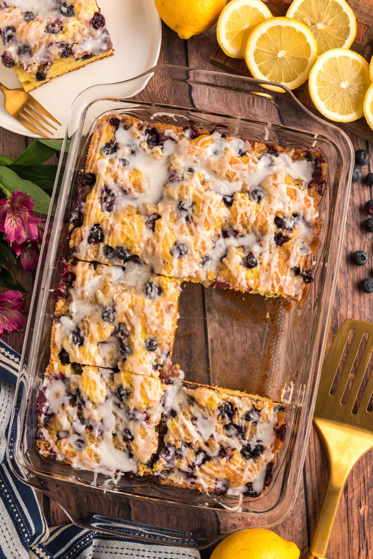 Glazed Lemon Blueberry Cake with a slice removed