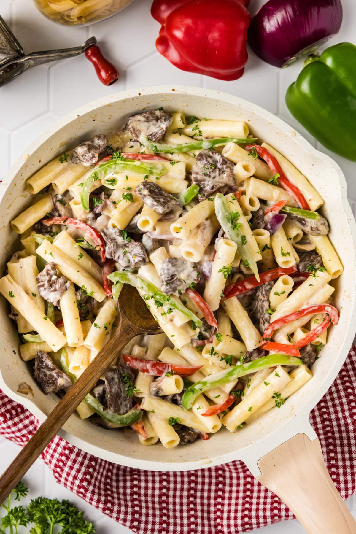 Skillet of Philly Cheesesteak Pasta with a spoon in it