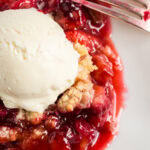 Close up photo of Prize Winning Rhubarb Crumble topped with ice cream