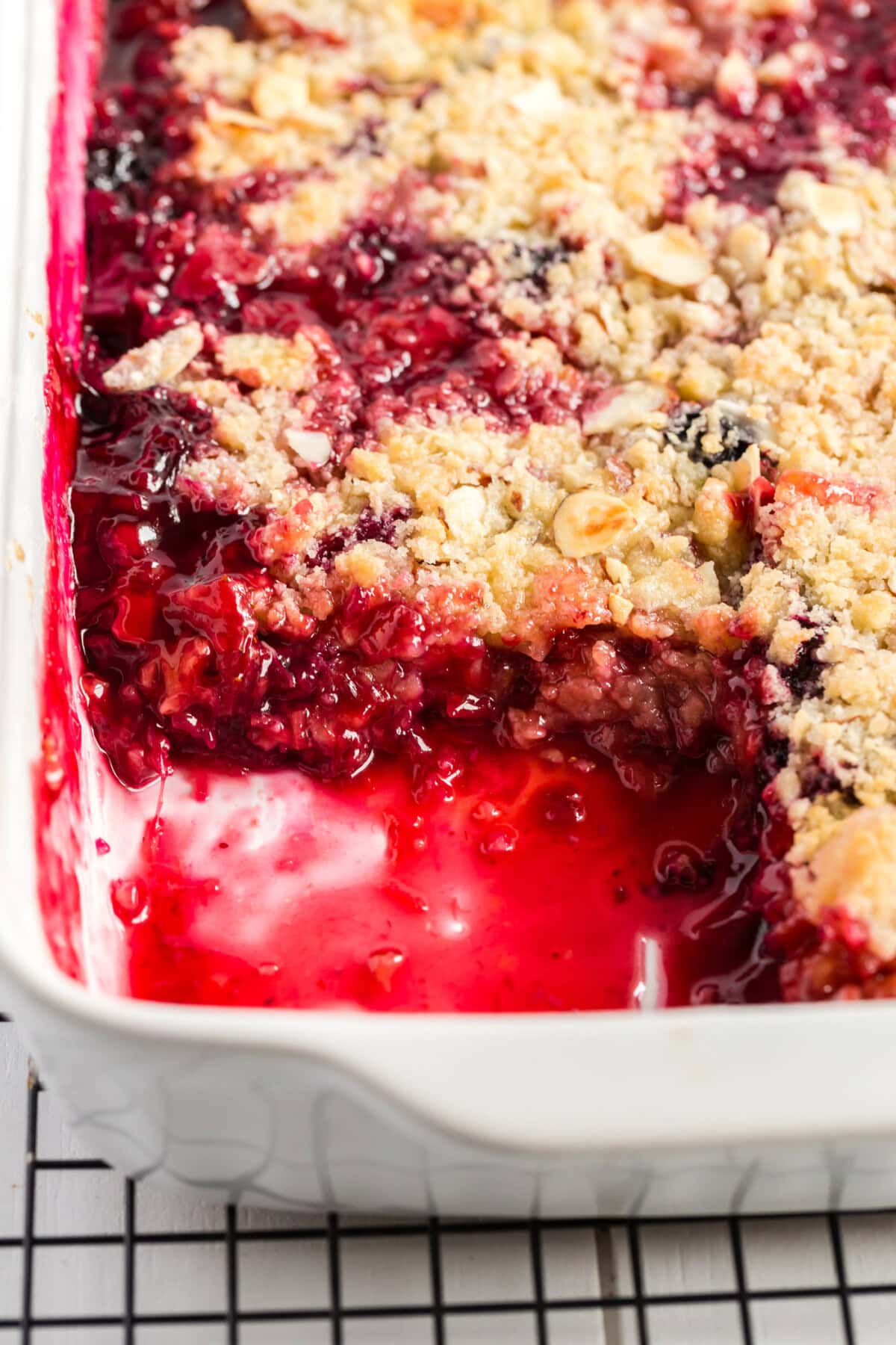 Baking dish of Prize Winning Rhubarb Crumble with a serving removed