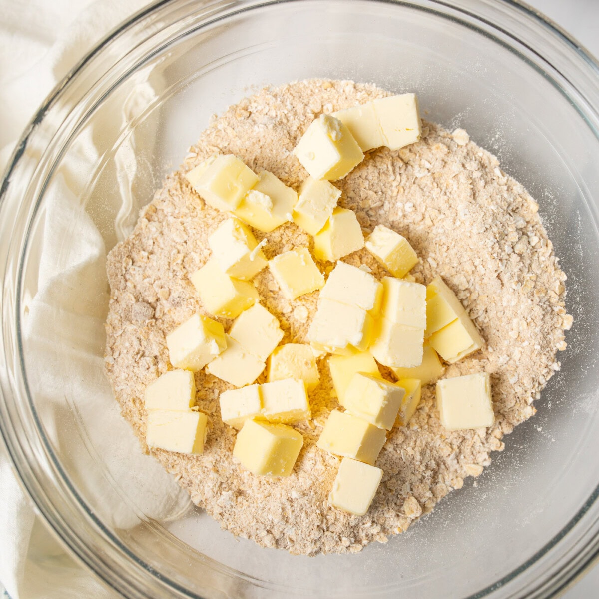 Flour mixture and butter cubes in a bowl