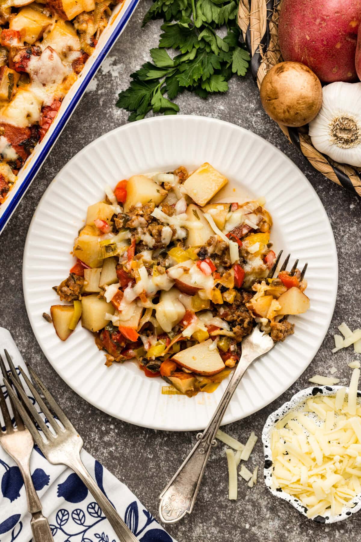 Plate of Sausage and Potato Casserole with a fork on the side