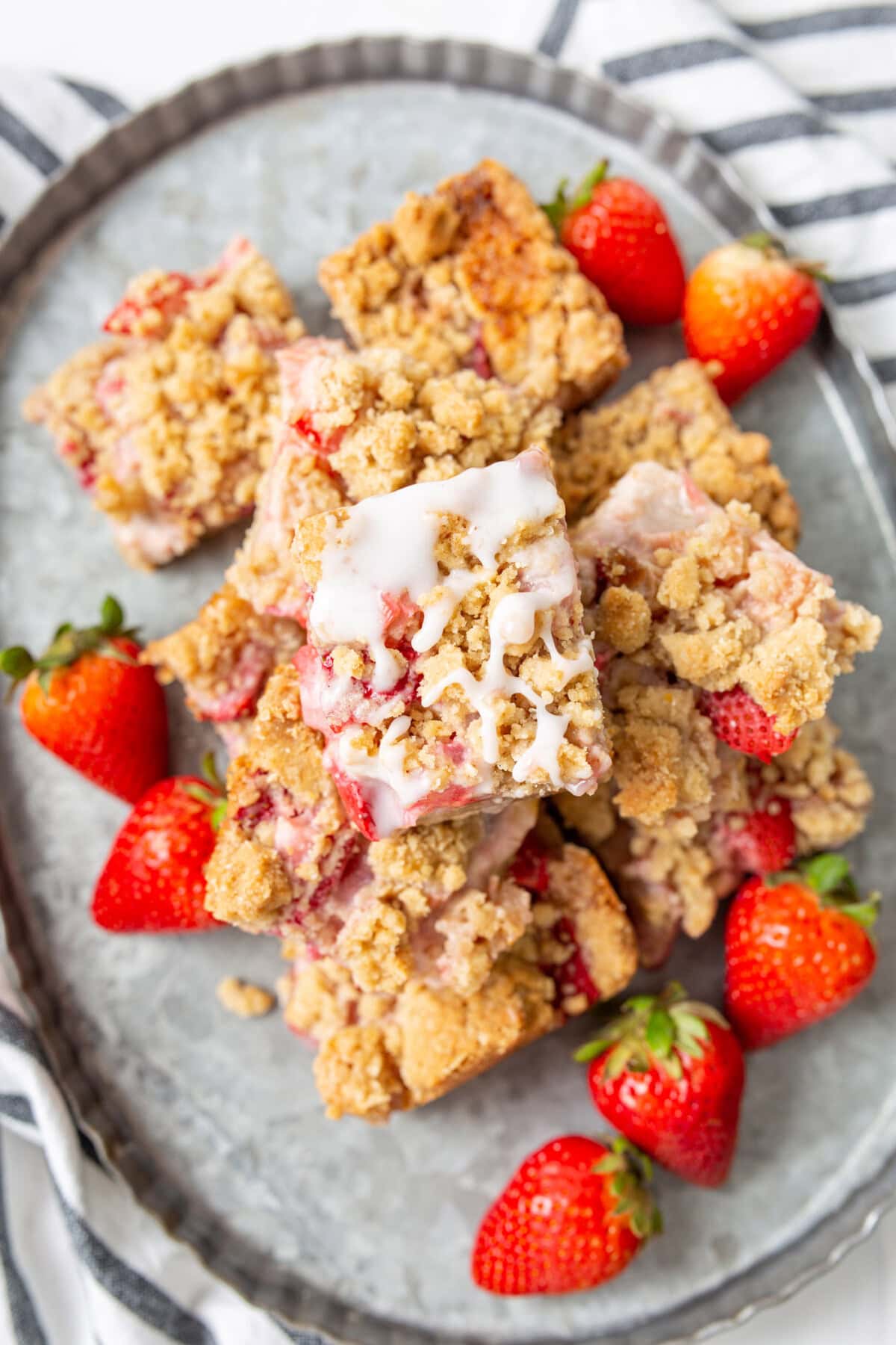 Strawberry Rhubarb Crumble Bars piled on a serving platter