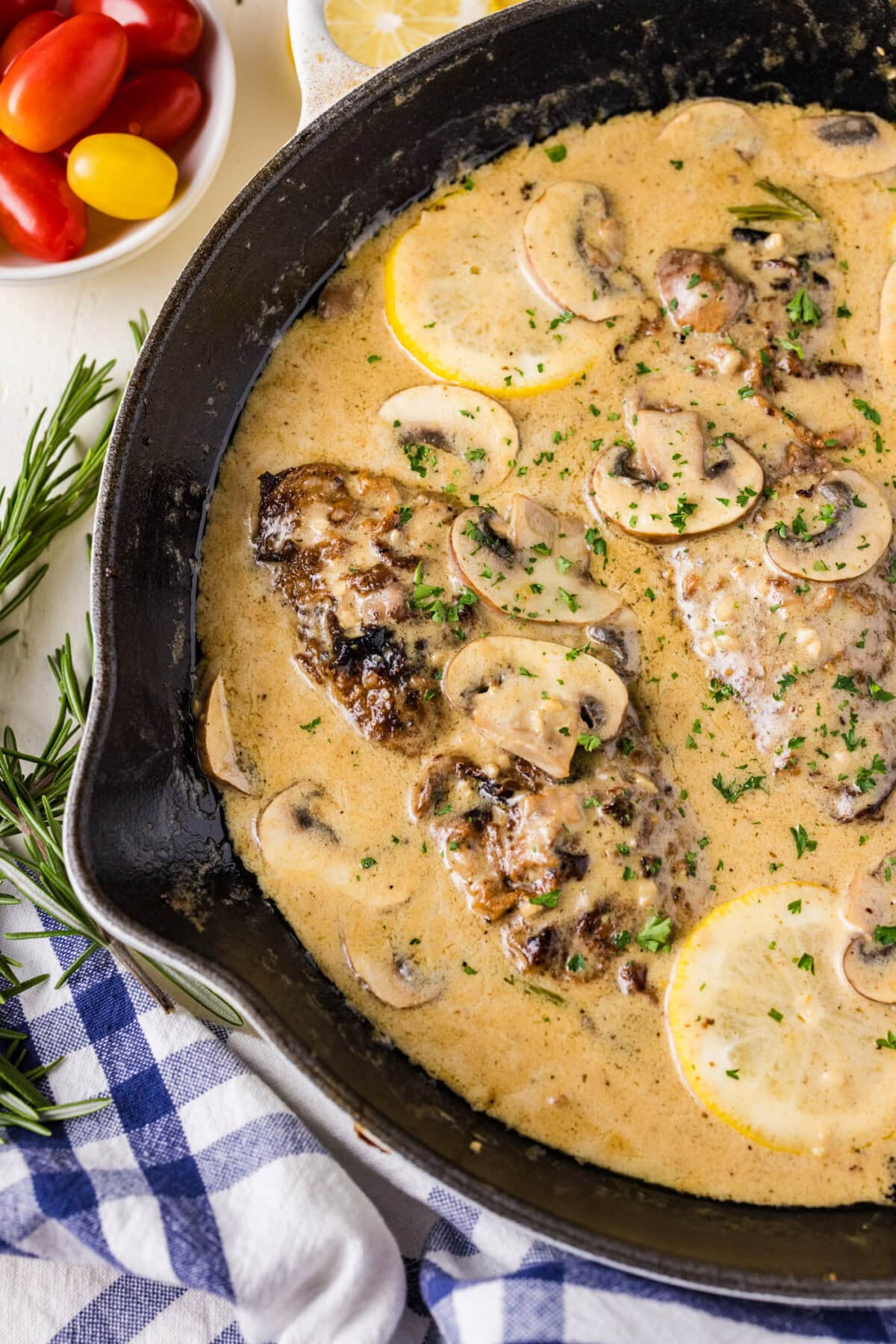 Close up photo of a skillet of Veal Scallopini