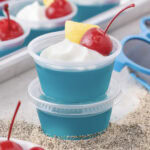 Close up photo of a stack of Blue Hawaiian Jello Shots