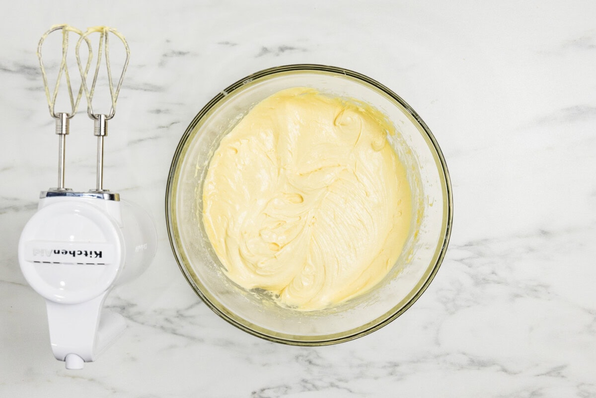 peach cake batter in a bowl