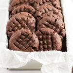 Close up photo of Chocolate Peanut Butter Cookies in a parchment lined basket