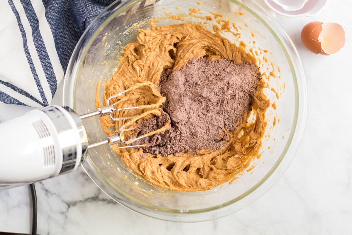 Flour mixture being added to the creamed mixture