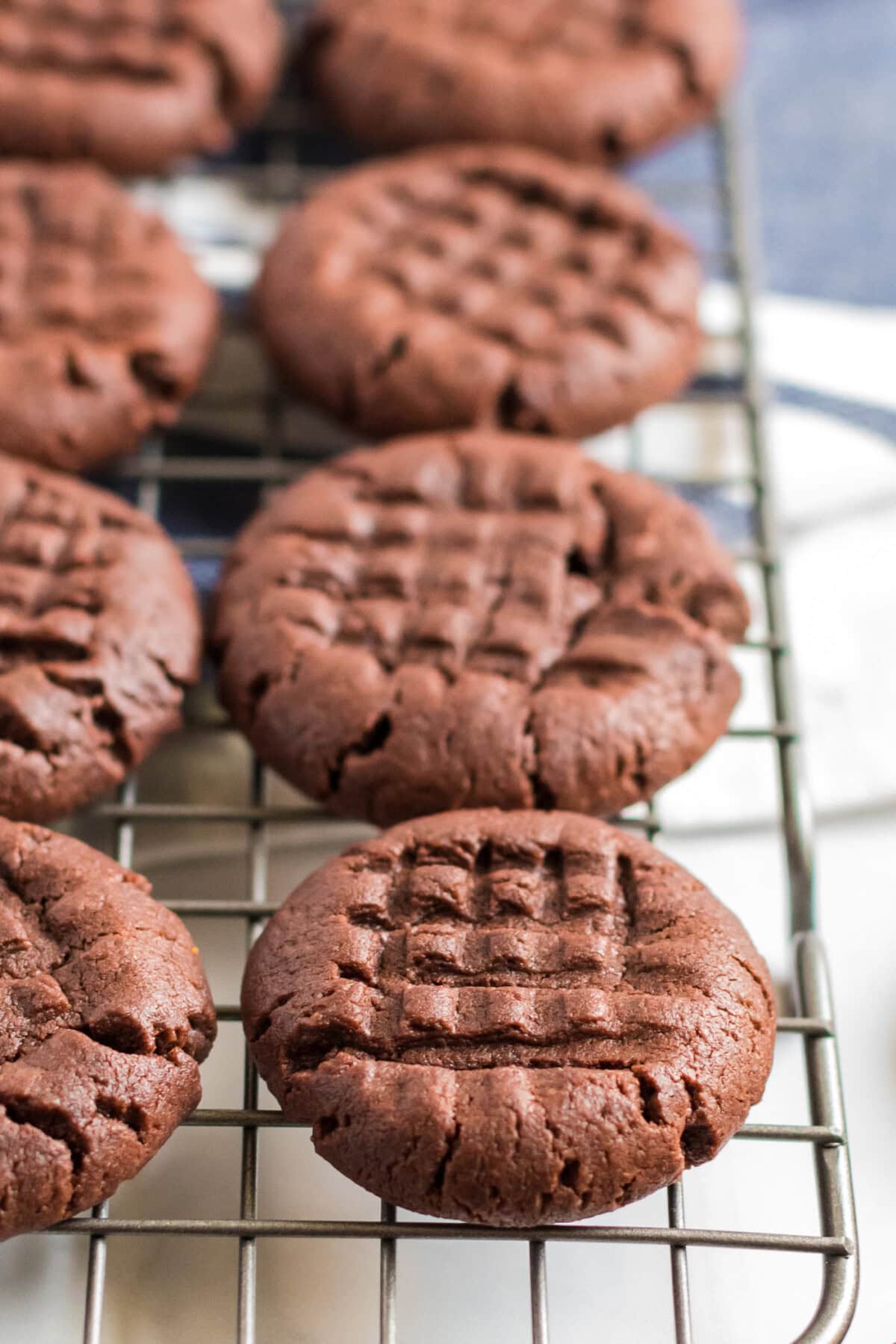 Close up photo of Chocolate Peanut Butter Cookies on a wire rack