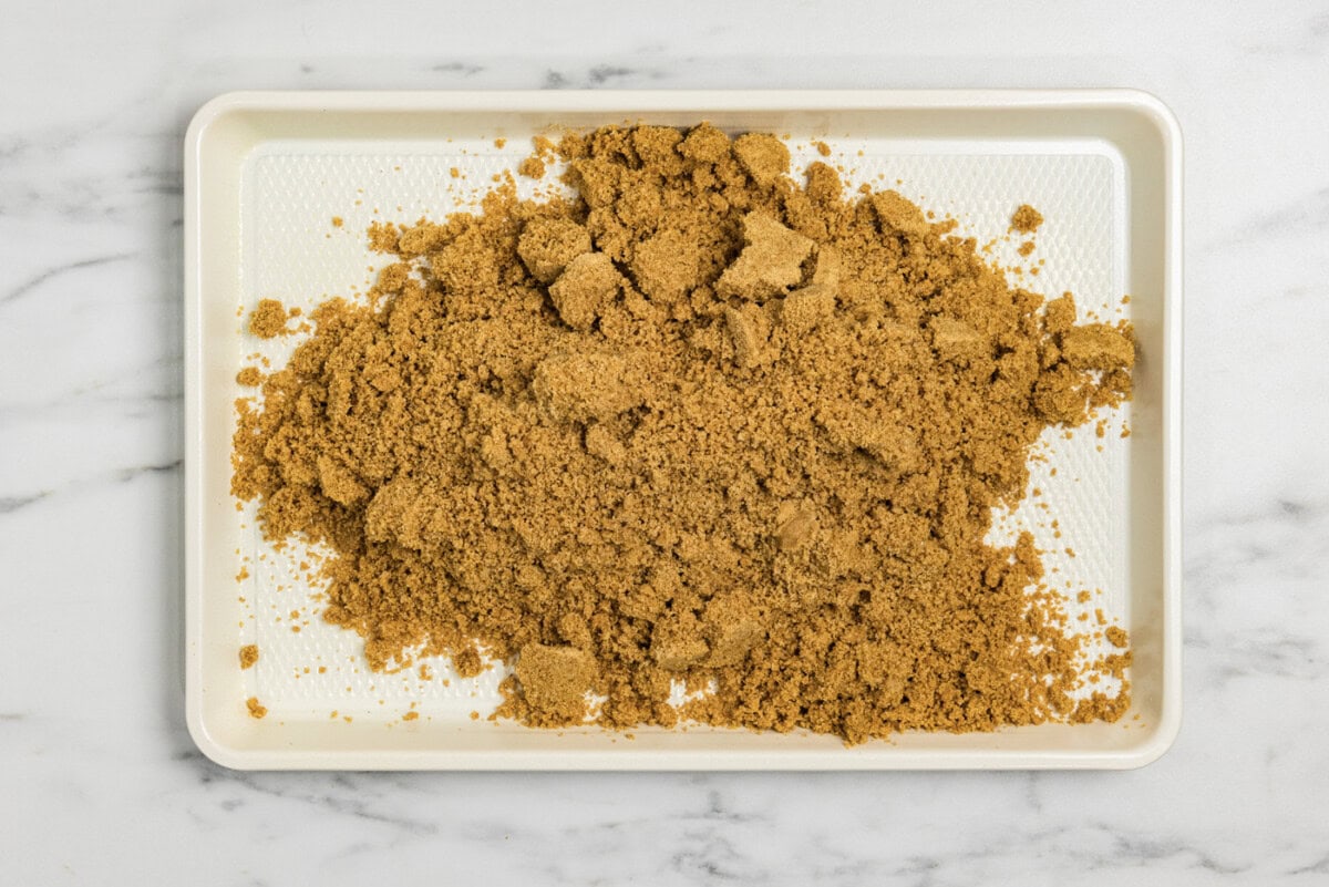 butter and graham cracker mixture in a baking pan