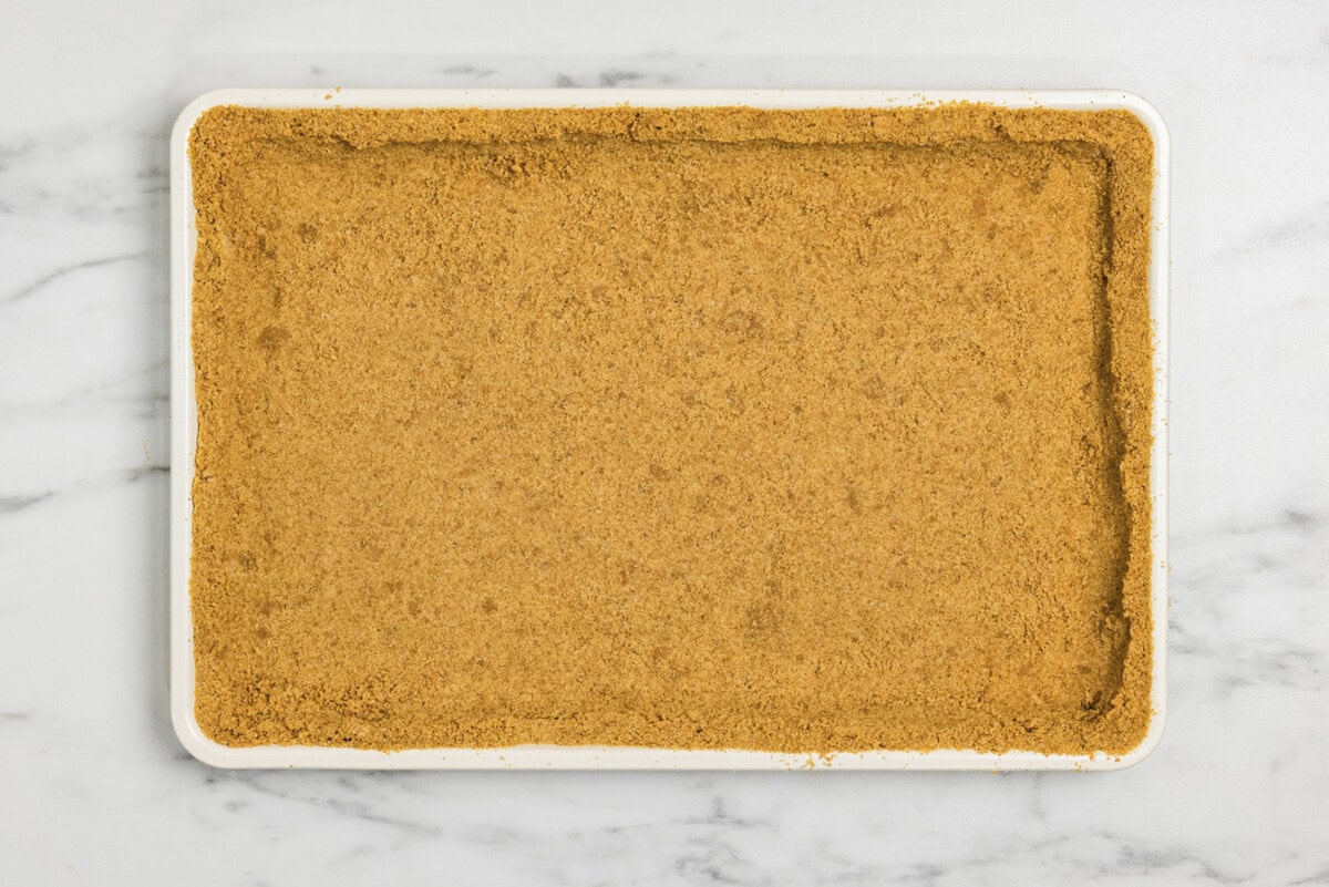 graham cracker crust lined in a baking pan