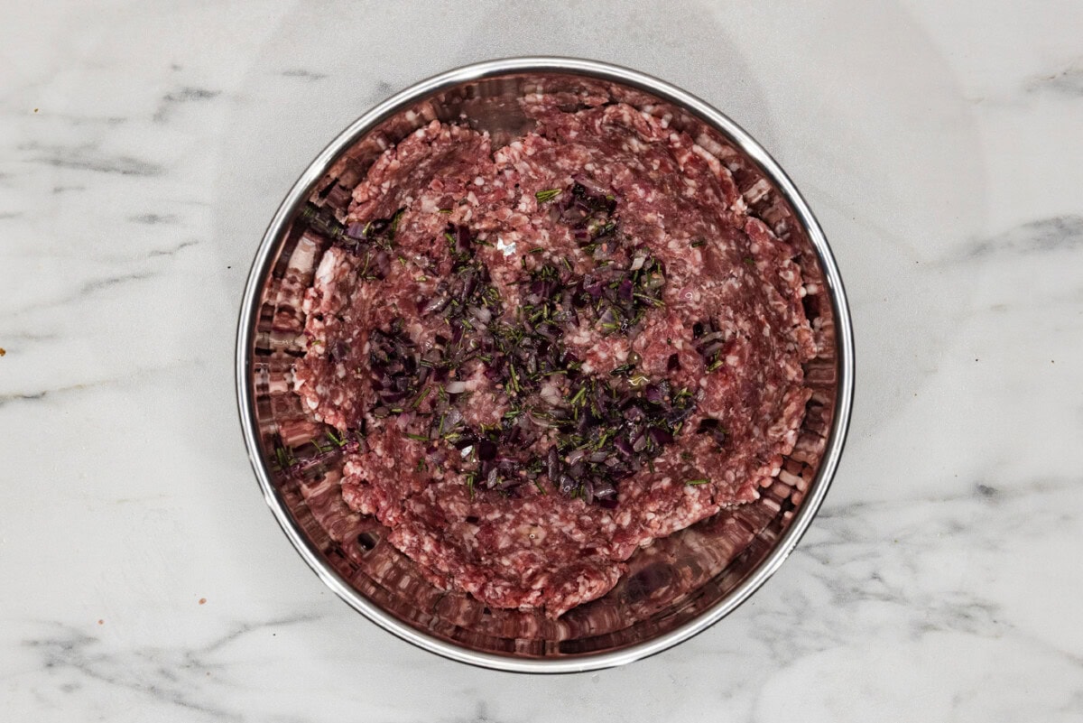 ground lamb with seasonings in a bowl