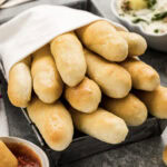 Olive Garden Breadsticks wrapped in a towel