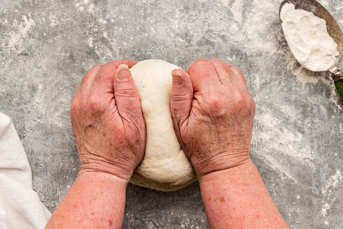 kneading dough with hands