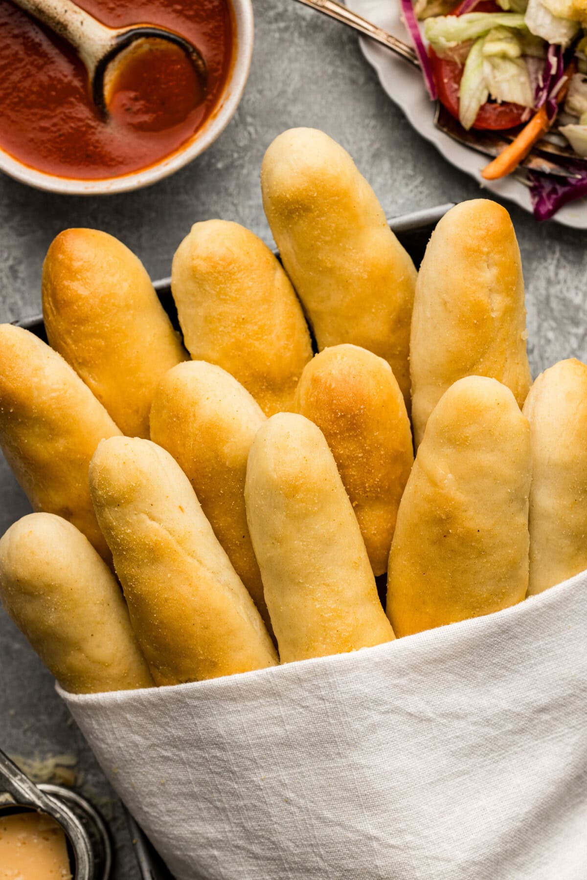 Overhead photo of Olive Garden Breadsticks wrapped in a towel