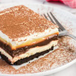 Close up photo of a slice of Sex in a Pan on a plate