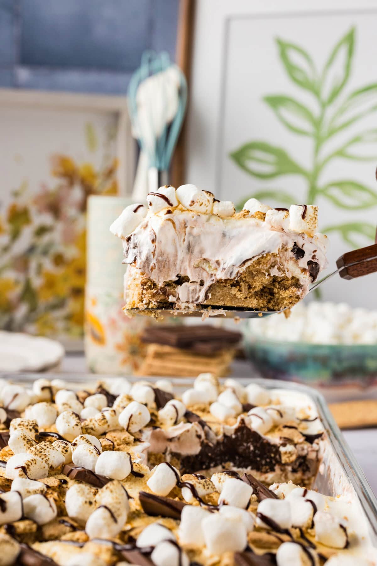 Slice of S'mores Lasagna being lifted out of the pan