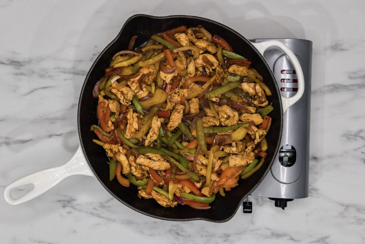 chicken fajitas in a cast iron skillet