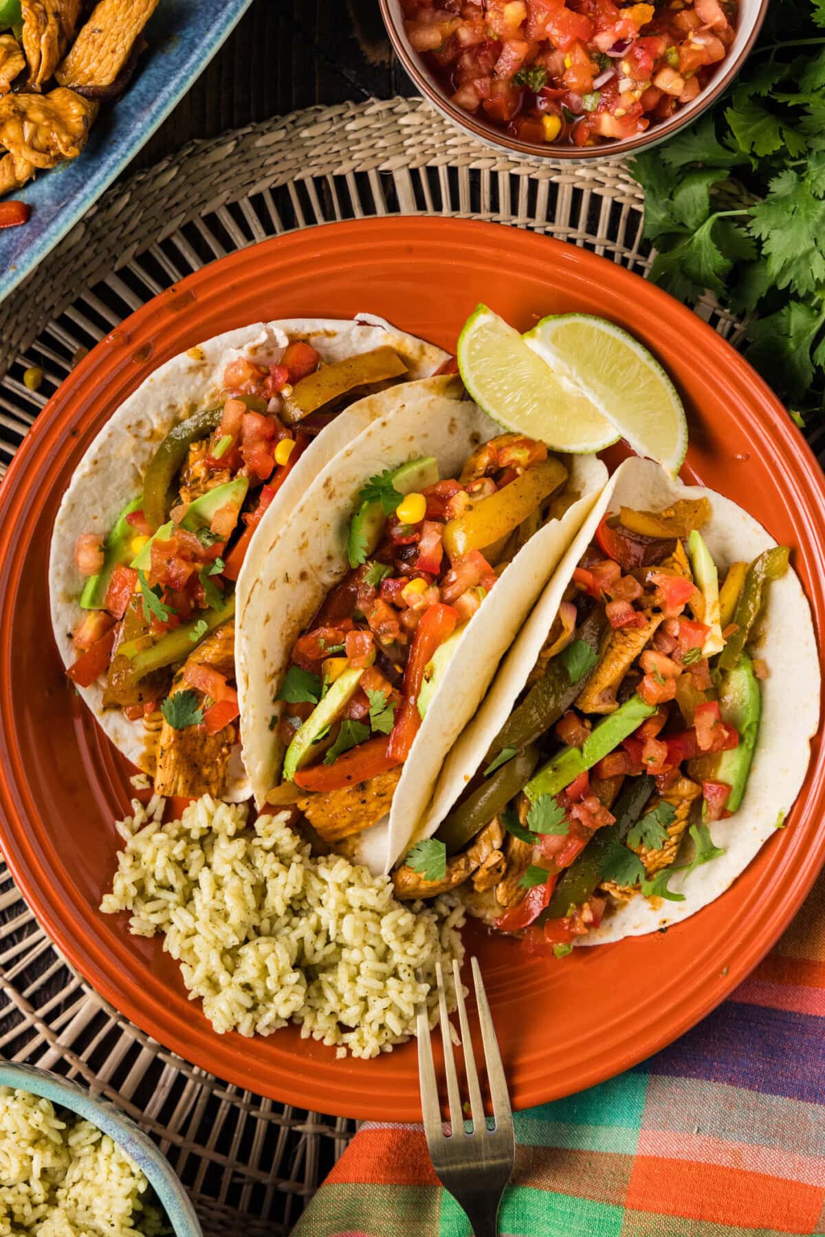 Chicken Fajitas wrapped in tortillas on a plate