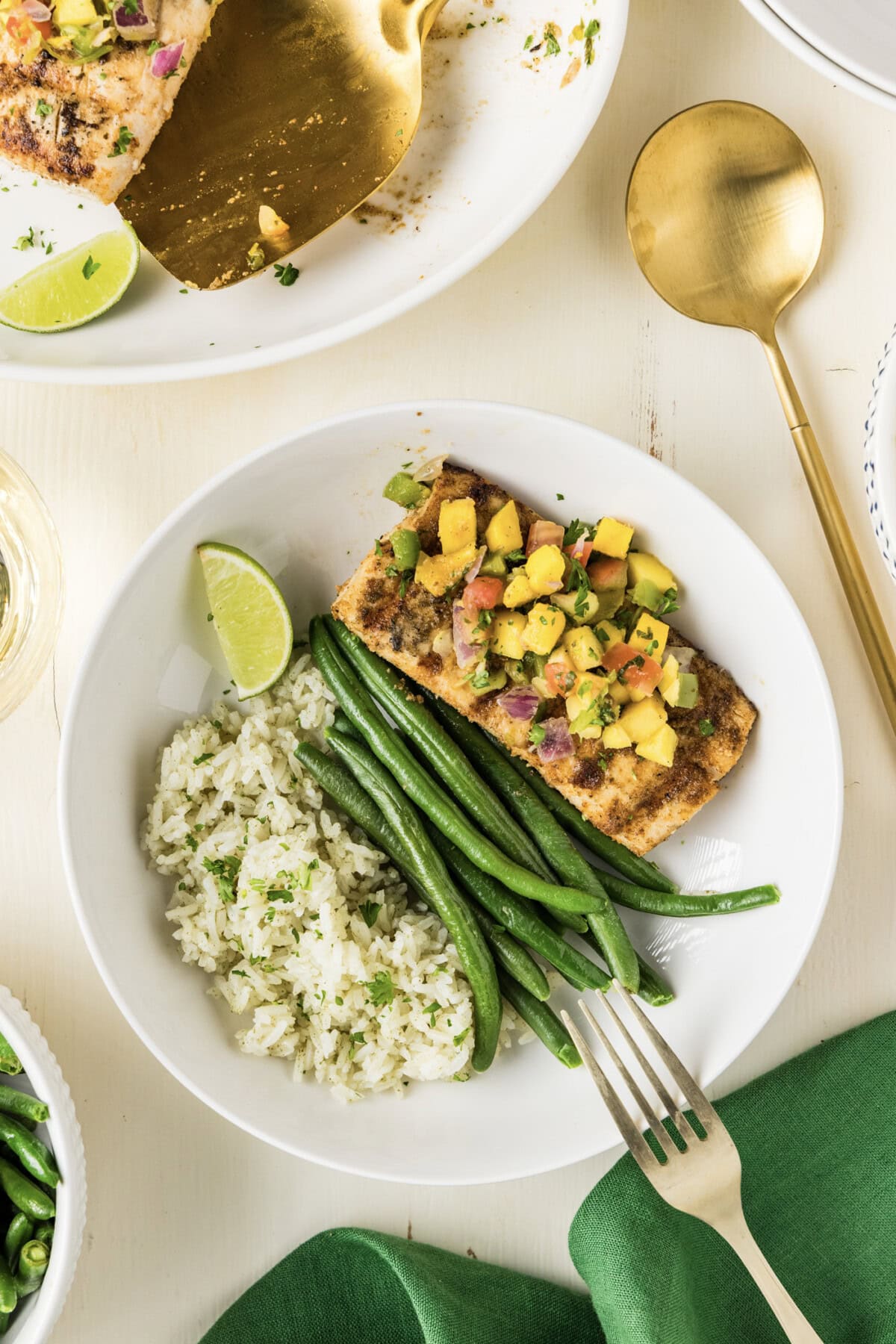 Grilled Mahi Mahi plated with cilantro rice and green beans