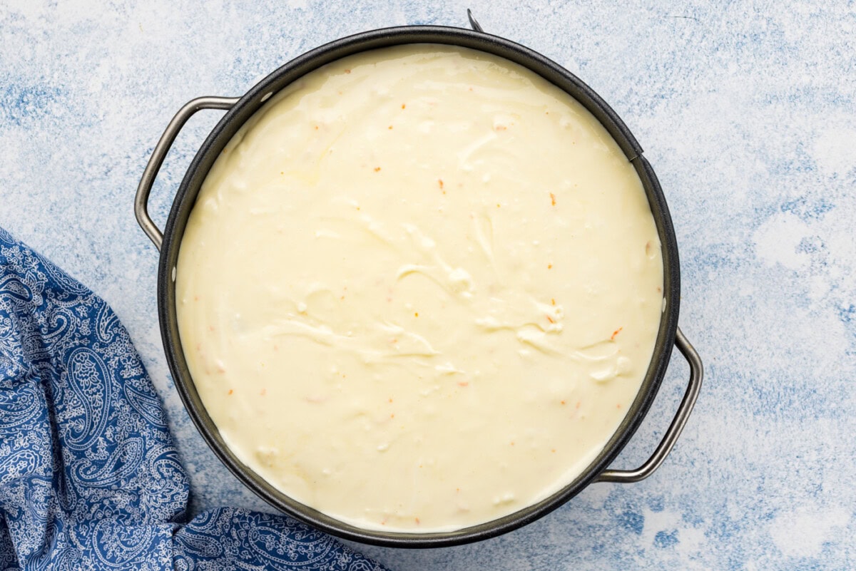Mandarin orange cheesecake batter in a pan