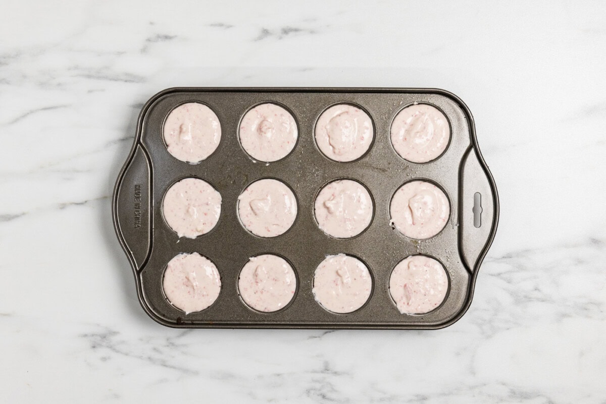 mini strawberry cheesecakes in a pan
