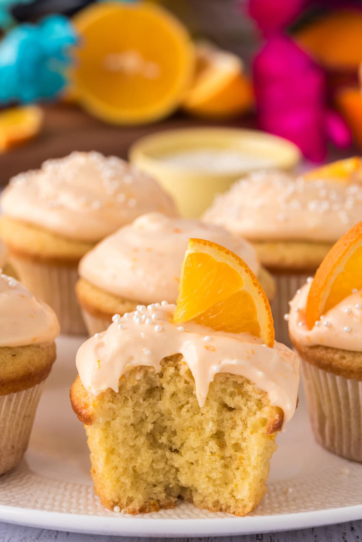 Orange Creamsicle Cupcake with a bite taken out