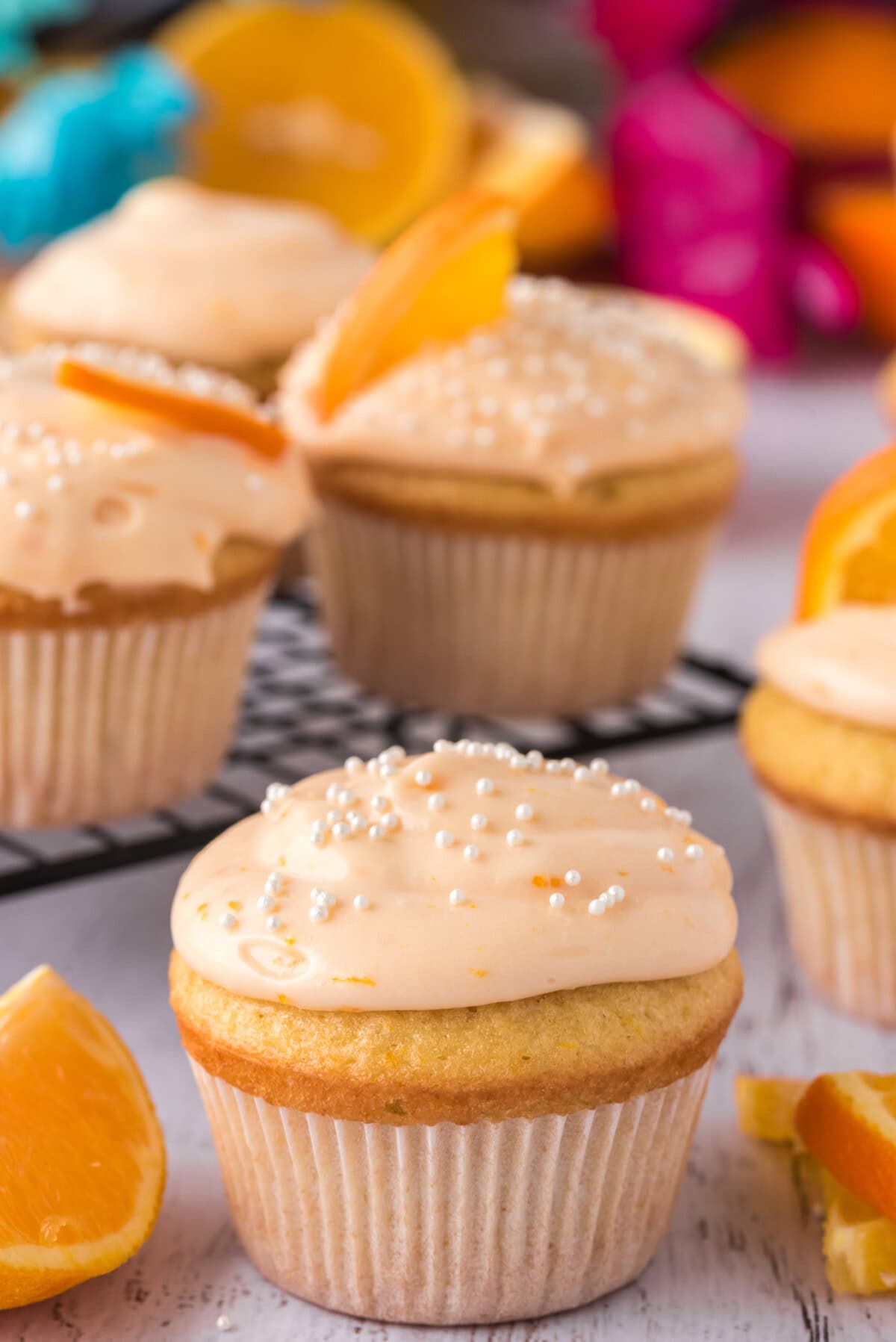 Orange Creamsicle Cupcakes surrounded by more Orange Creamsicle Cupcakes