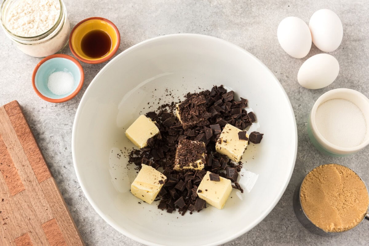 sliced butter pats with chopped chocolate in a bowl