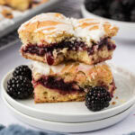 Stack of two Blackberry Pie Squares with a bite taken from the top one