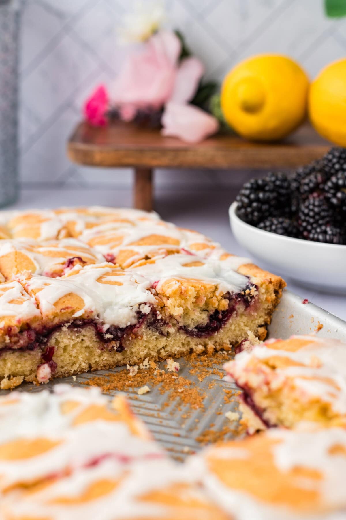 Side photo of Blackberry Pie Squares in a jelly roll pan with some removed