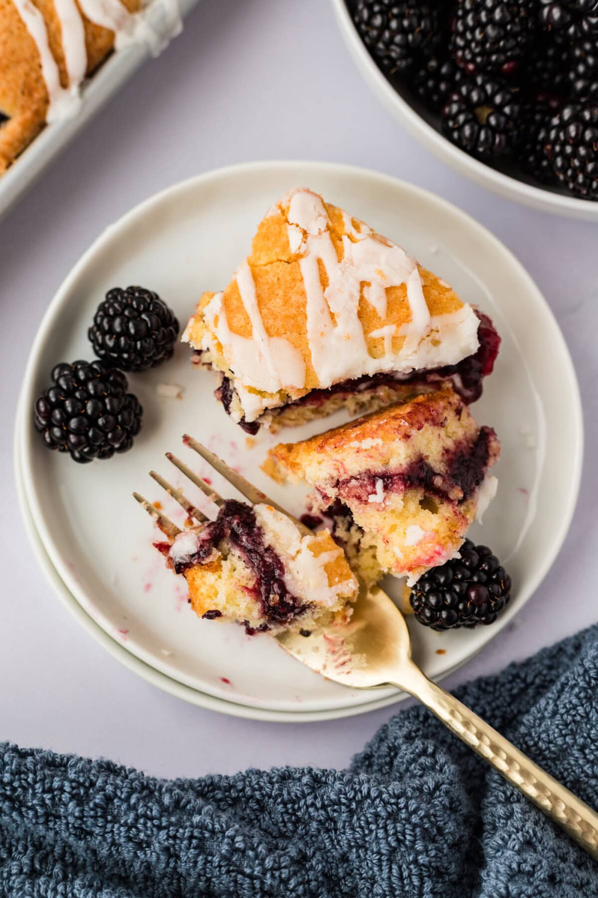 Blackberry Pie Square broken up on a plate with a fork