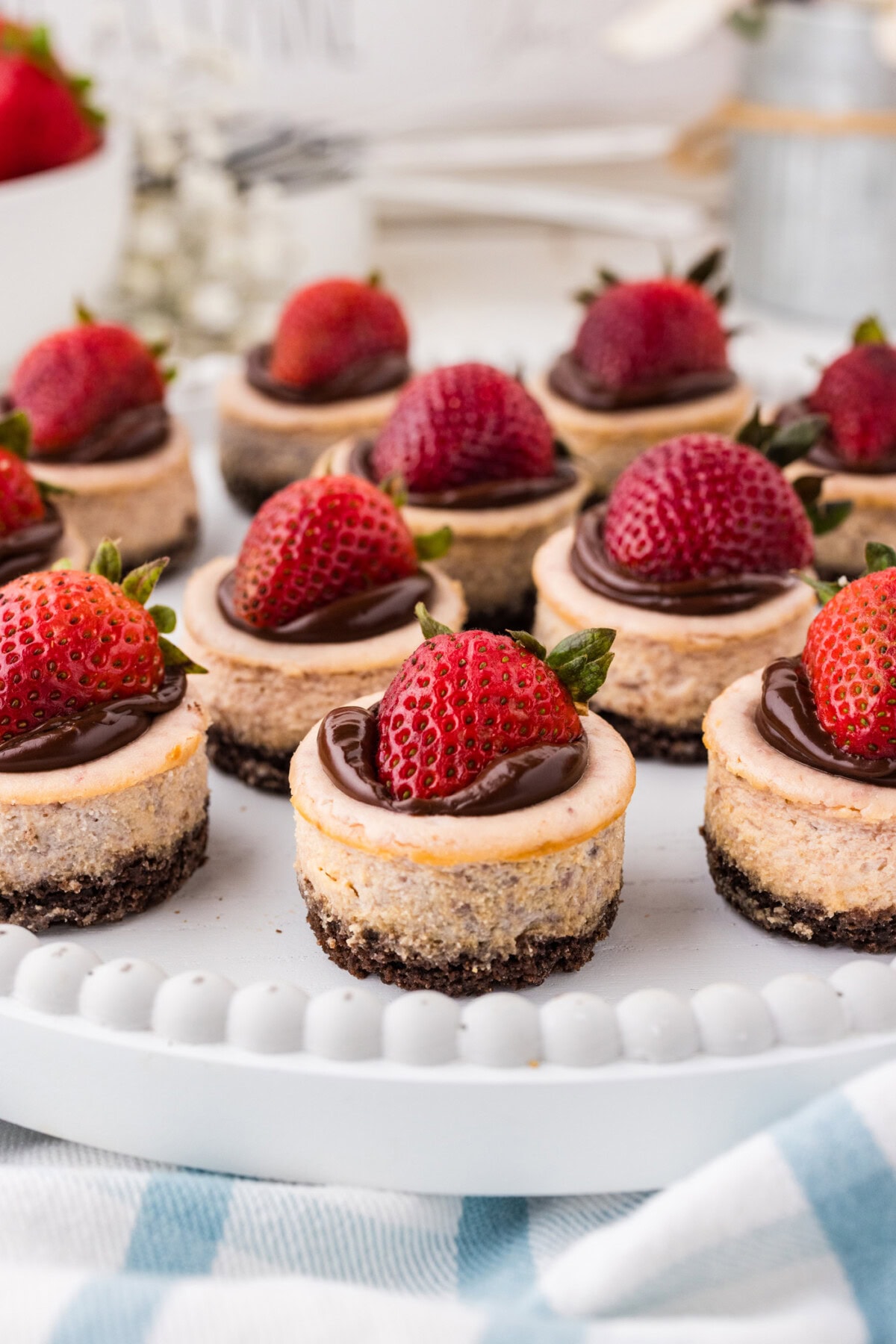 Mini Strawberry Cheesecakes on a white platter