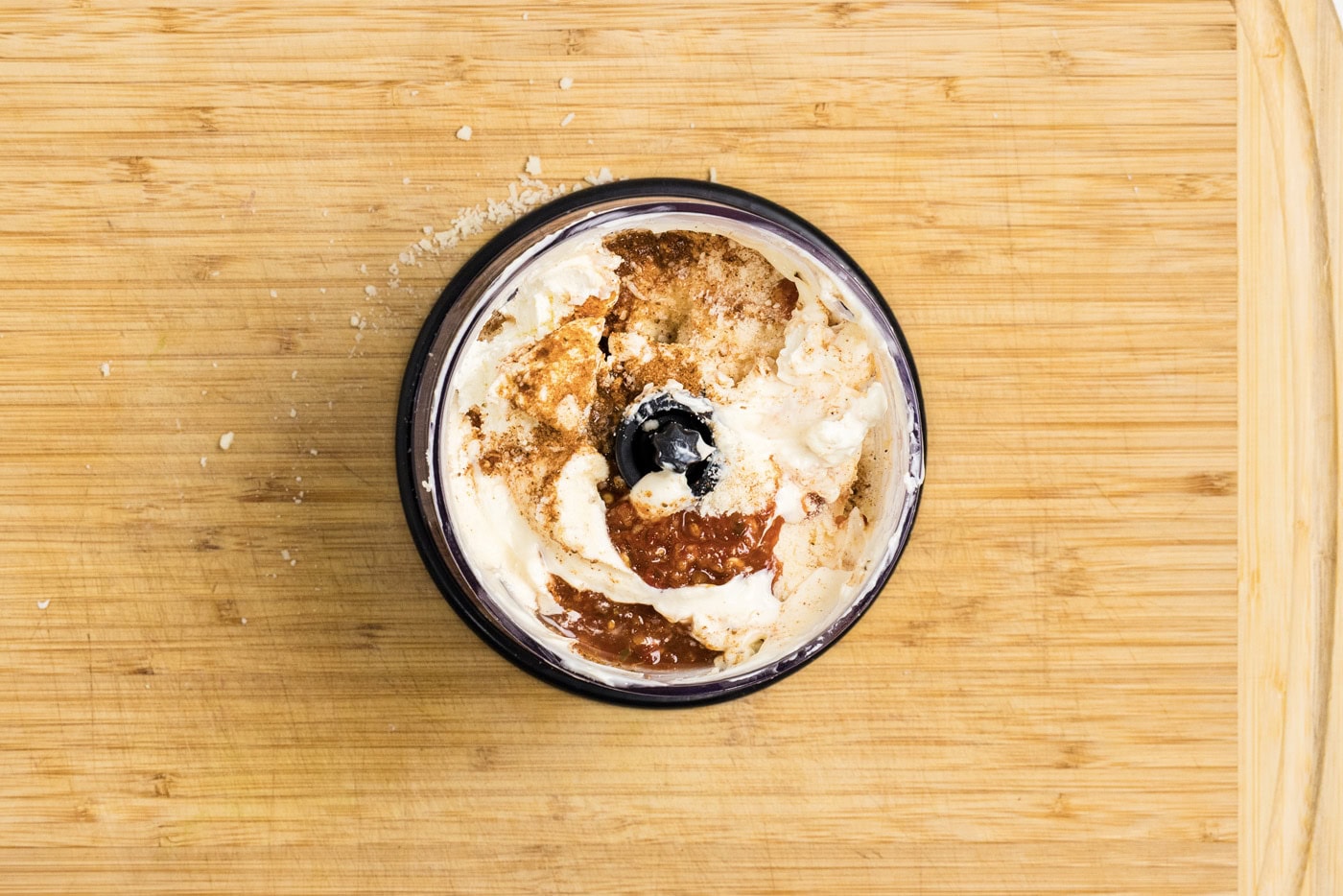 overhead photo of all the sauce ingredients in a mini food chopper