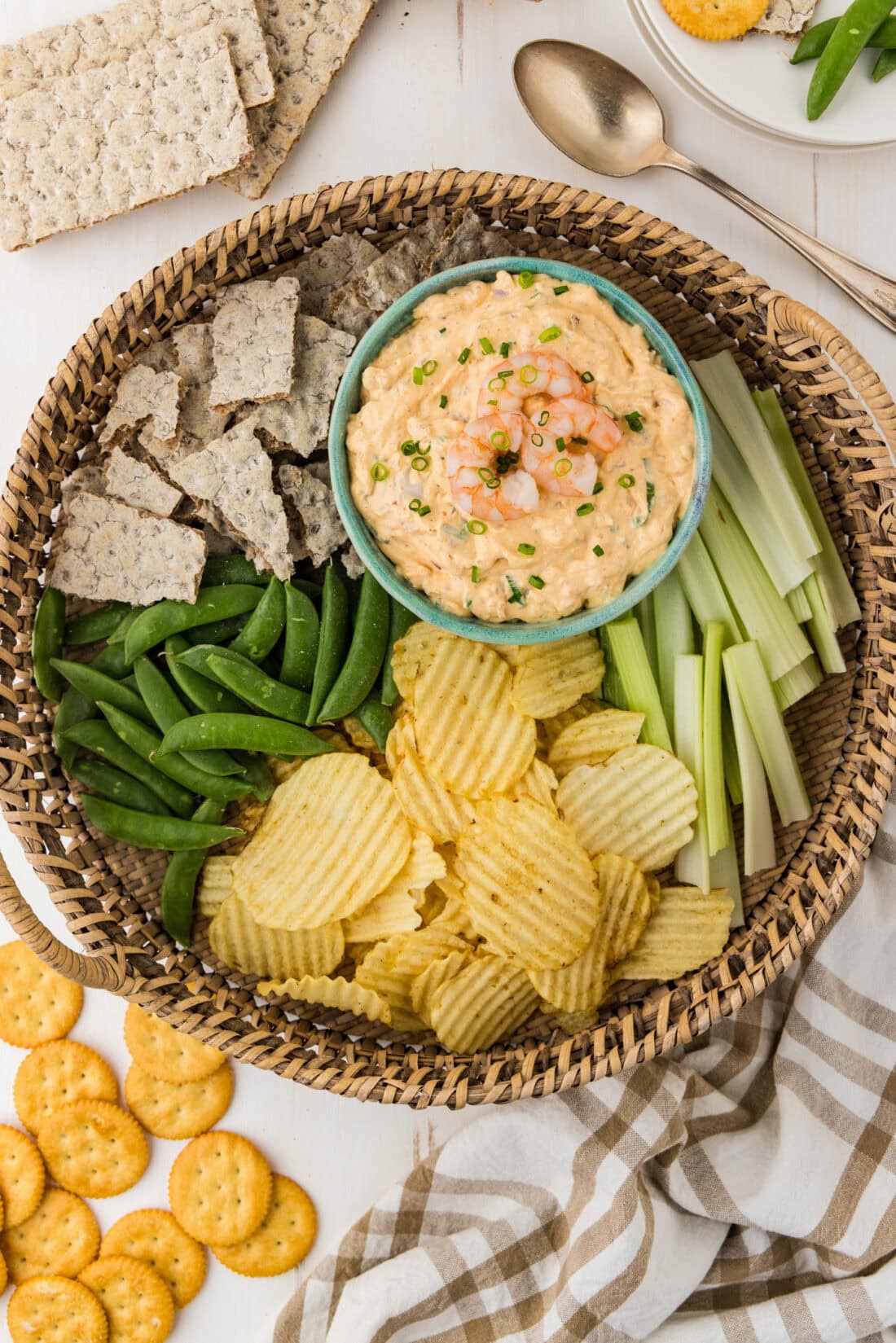 Bowl of Shrimp Dip on a platter with chips and veggies