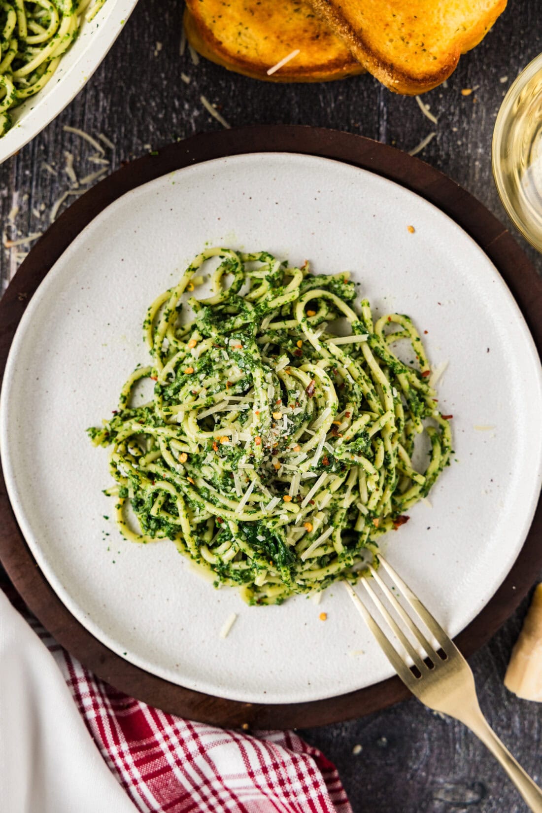 Plate of Spinach Spaghetti with a fork resting on the side