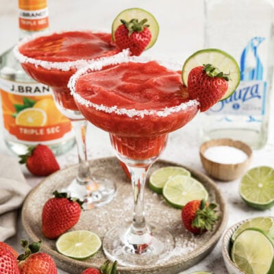 Close up photo of two Strawberry Margaritas on a serving platter